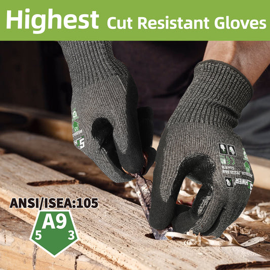 Black ANSI A9 cut resistant work glove holding sharp broken glass pieces on white background