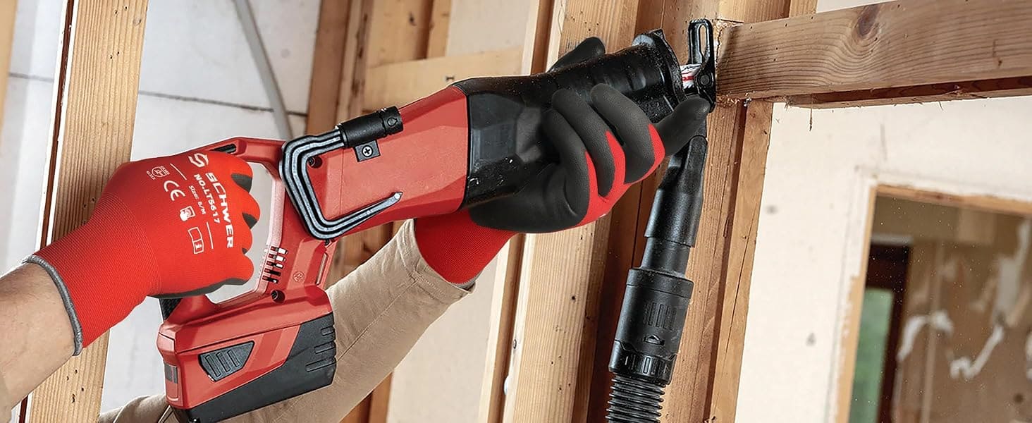 Person using a red power tool on wooden beams