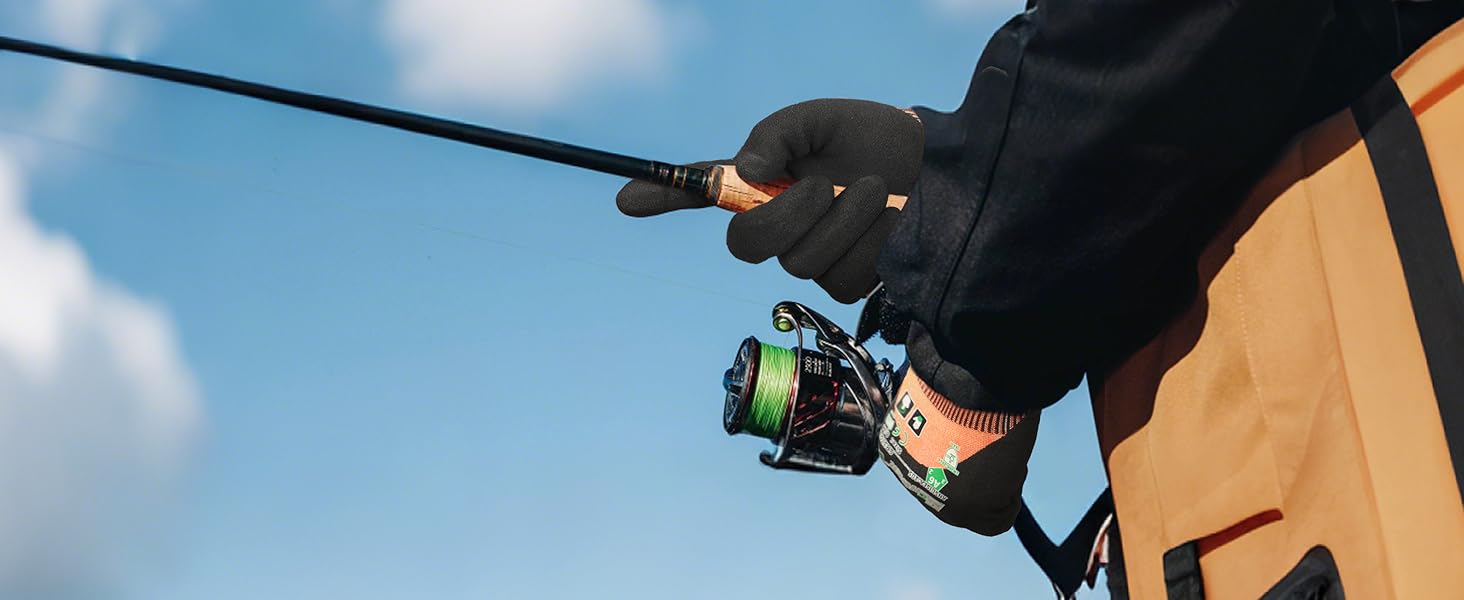 Person holding a fishing rod with a clear blue sky in the background
