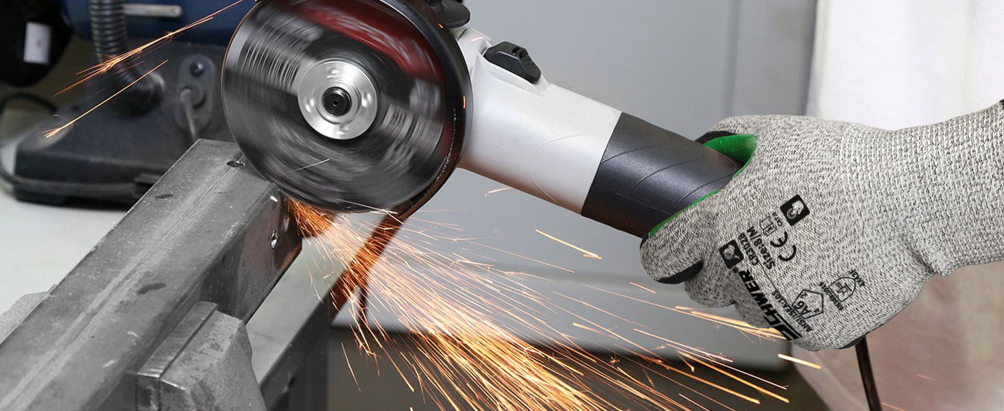 Person using an angle grinder with sparks flying, wearing a protective glove.