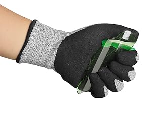 Hand wearing a cut-resistant glove holding a smartphone with a white background