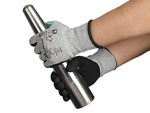 Person wearing cut-resistant gloves holding a metal object on a white background