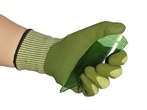 Green gardening gloves being worn on a white background