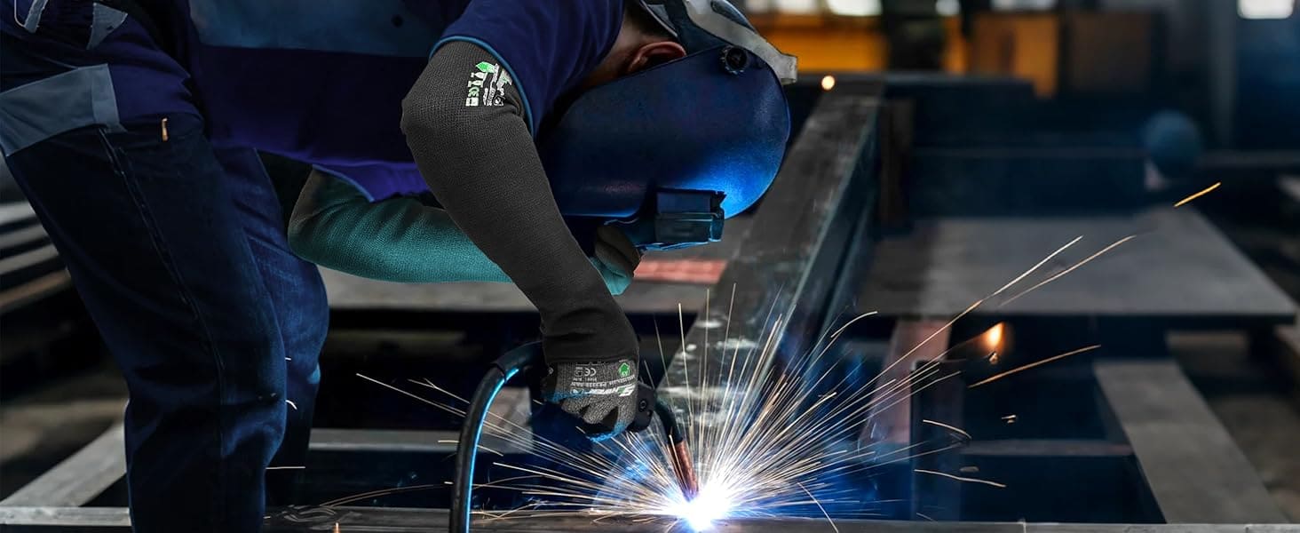 Person welding metal with sparks flying, wearing protective gear.