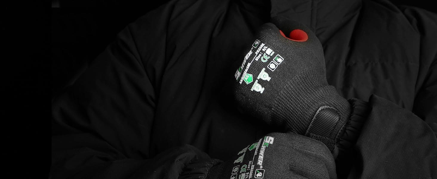 Person wearing black gloves with visible branding against a dark background