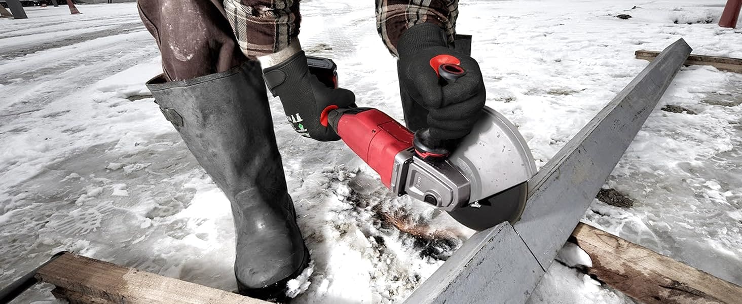 Person using a chainsaw on a snowy ground