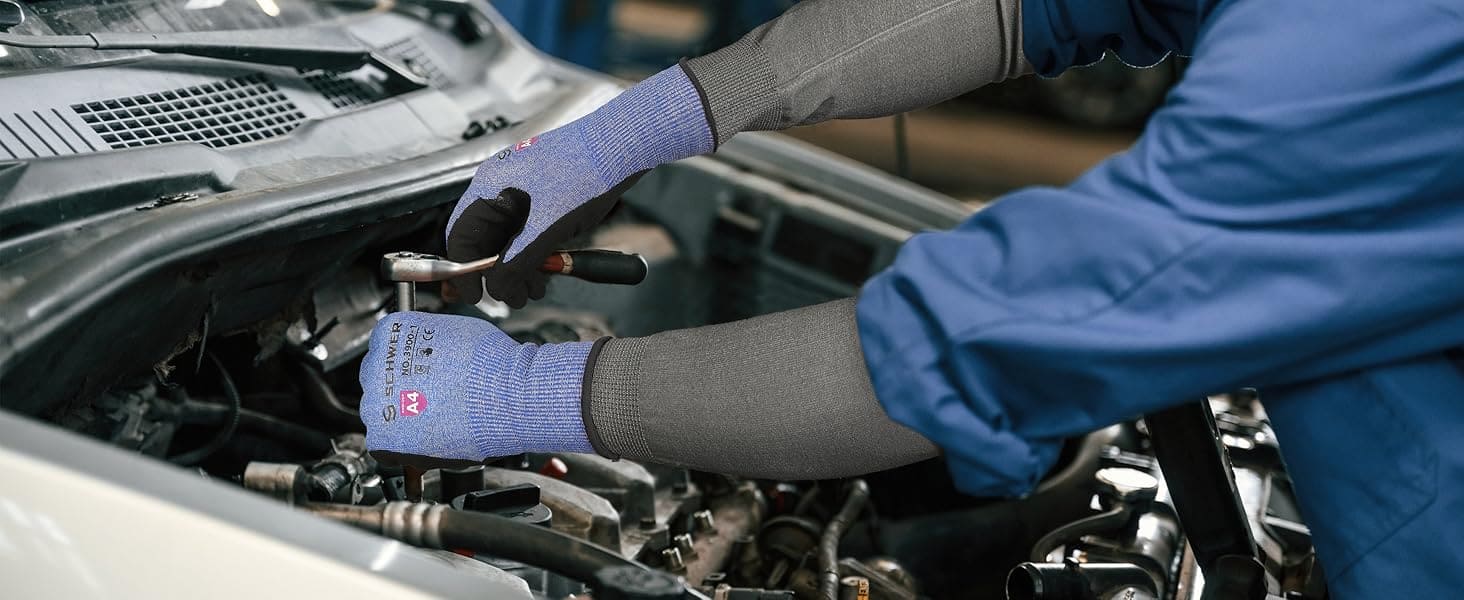 Person working on a car engine with gloves on