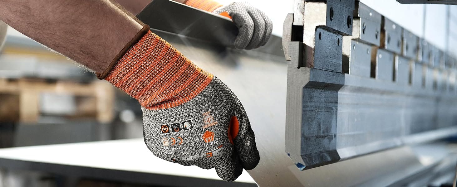 Person wearing a glove using a metal cutting tool in a workshop setting