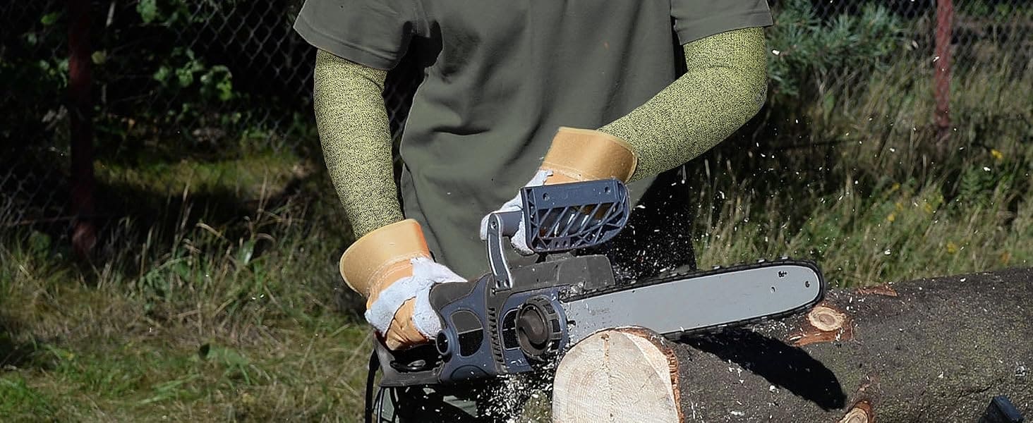 Person using a chainsaw to cut a log outdoors