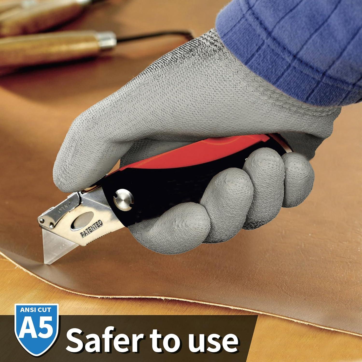 Close-up of hand wearing gray cut-resistant glove holding a red utility knife cutting brown material with ANSI A5 safety rating