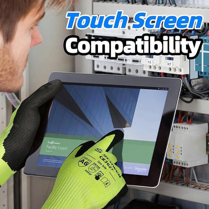 Technician wearing bright green protective gloves using a touchscreen device for electrical panel work, showing touch screen compatibility