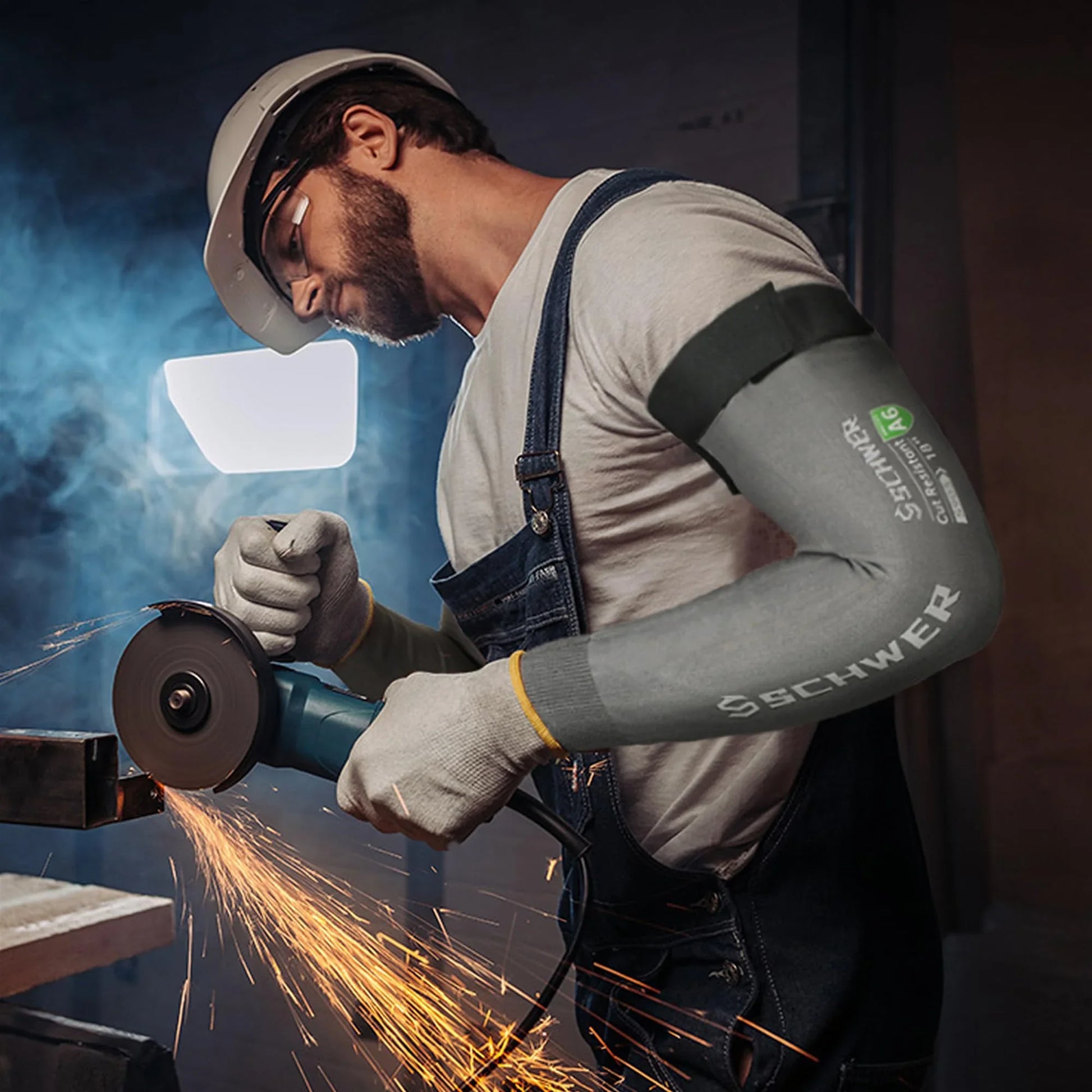 Person wearing a Schwer sleeve while using a grinder with sparks flying.