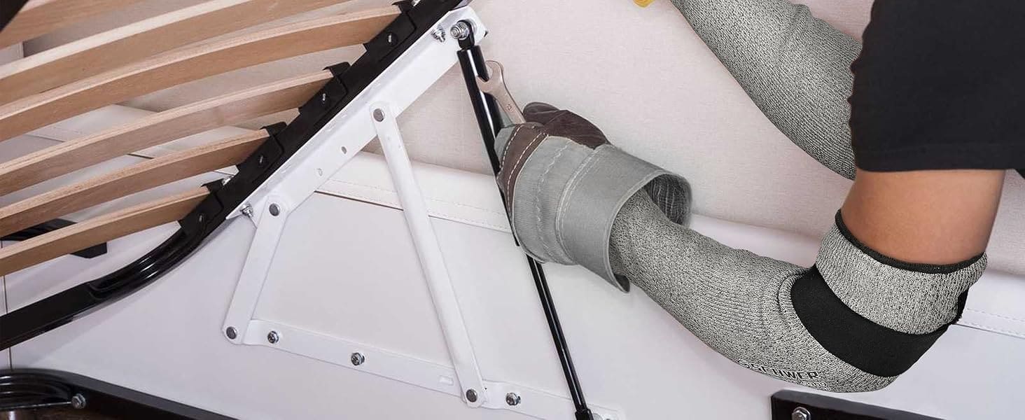 Person wearing gloves working on a mechanical or technical component.