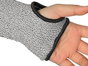Hand wearing a gray wrist support brace with black trim