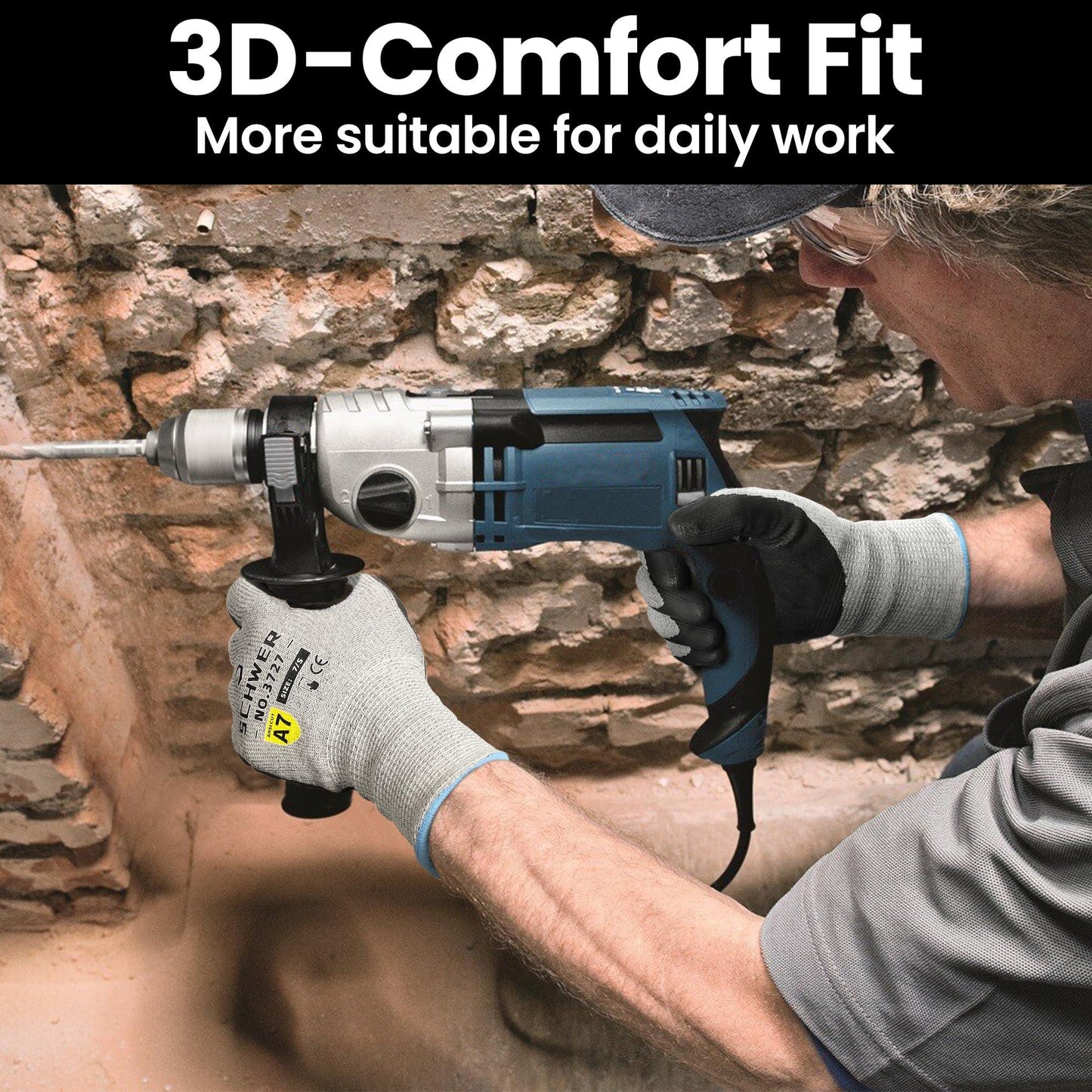 Worker wearing industrial gloves using a blue electric drill on a rough stone wall indoors