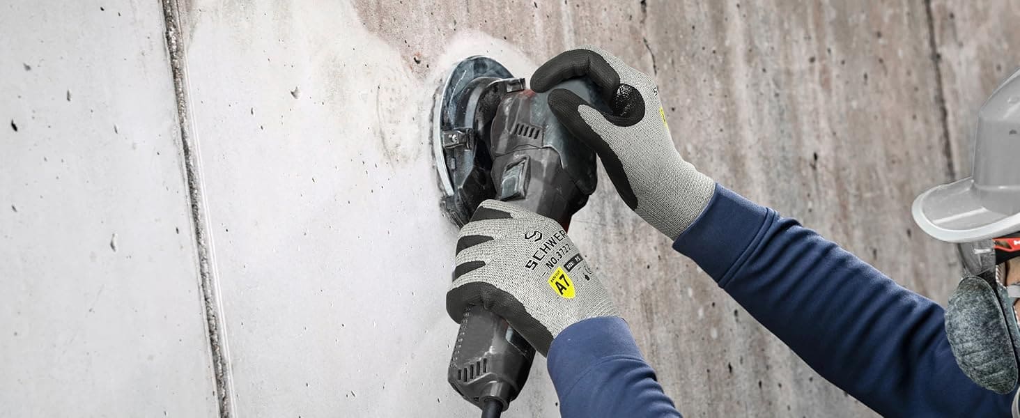 Person using a power tool on a concrete surface