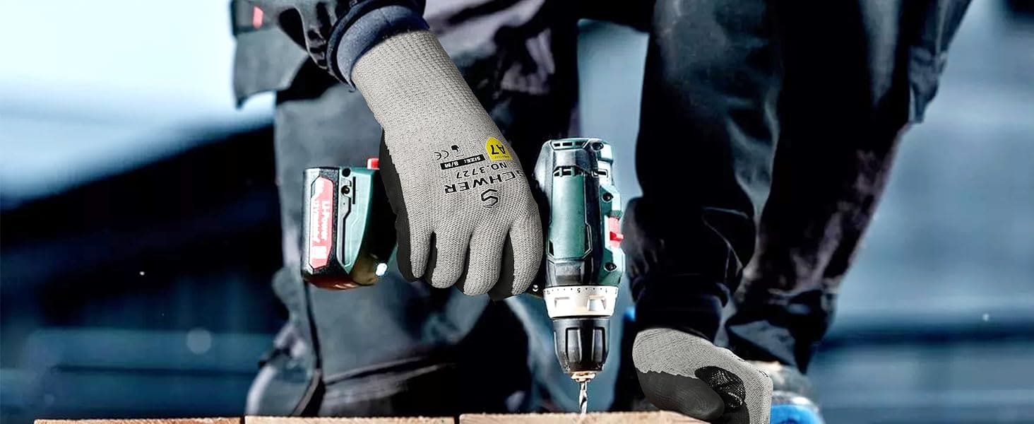 Person using a drill with tools on a wooden surface
