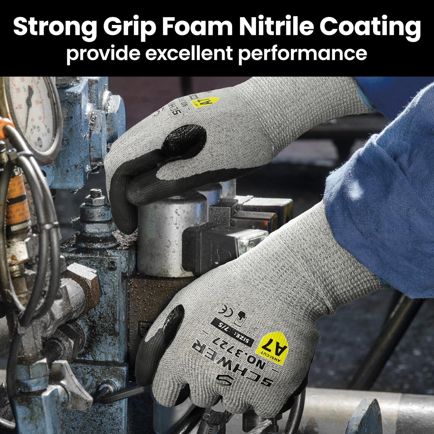 Worker wearing gray Schwer nitrile foam coated gloves handling industrial machinery parts