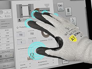 Hand wearing a glove with a digital interface and measurement tools in the background