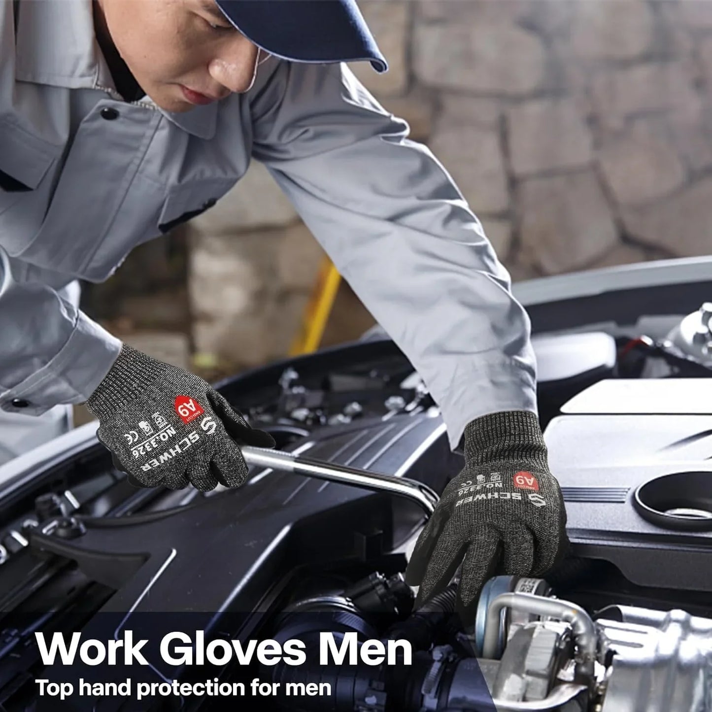 Man wearing gray work gloves fixing a car engine with a wrench in a workshop