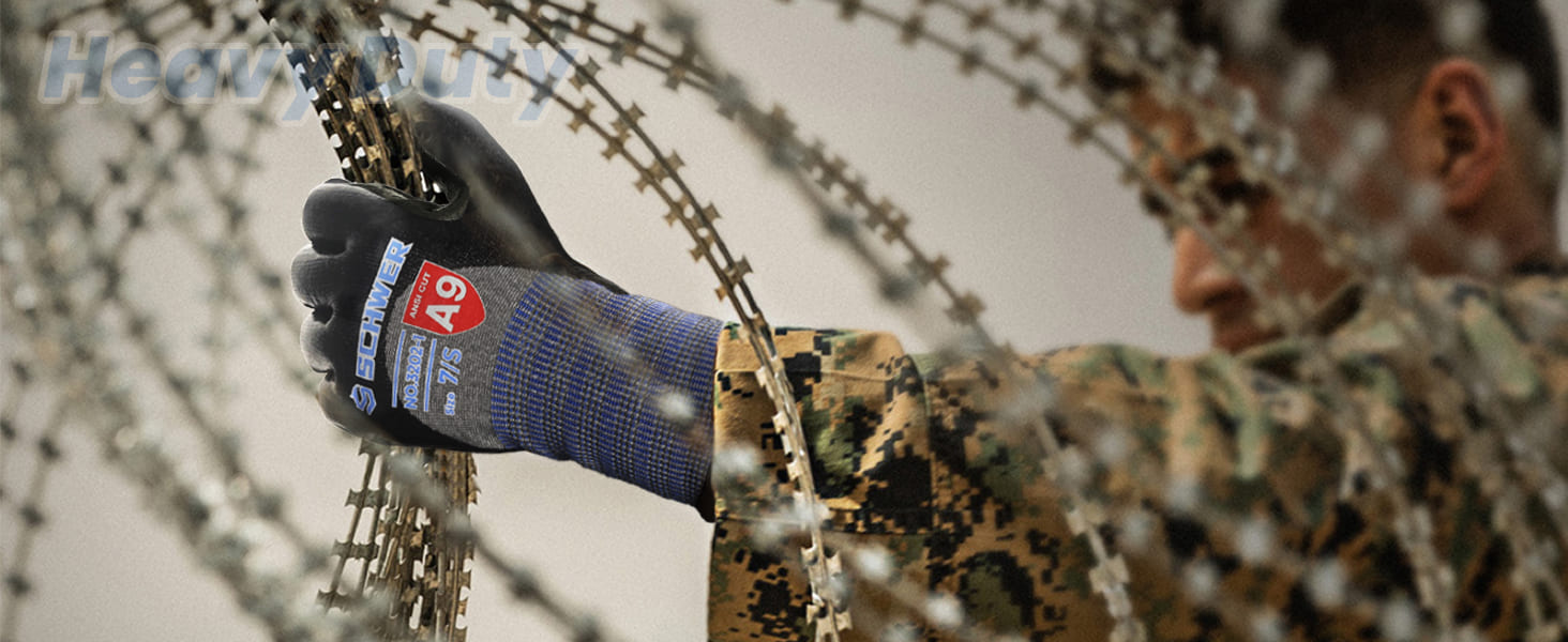 Person wearing a glove with a brand logo, interacting with barbed wire.