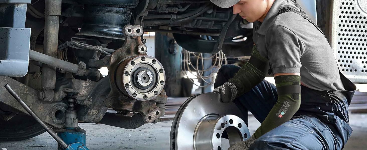 Mechanic working on a vehicle's brake system