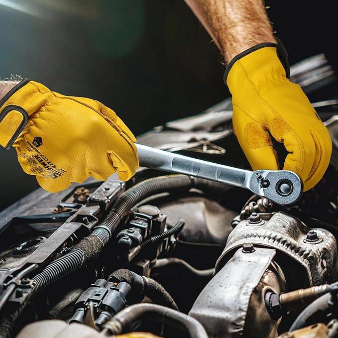 Worker wearing Schwer yellow cut resistant gloves using a wrench on car engine