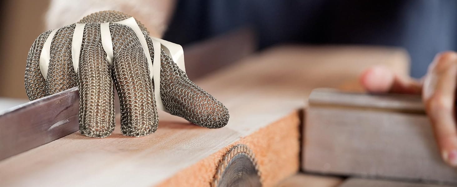 Hand wearing a metal mesh glove sanding a wooden surface
