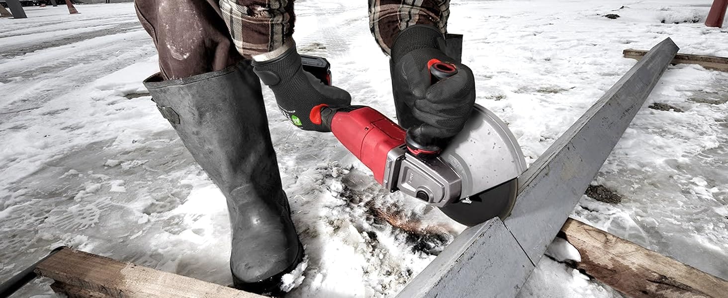 Person using a chainsaw on a snowy ground