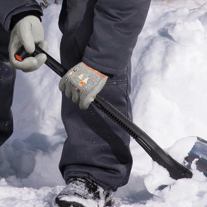Person wearing gray cut-resistant gloves shoveling snow with a black snow shovel