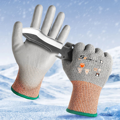 Gray and orange cut-resistant gloves holding a serrated knife against a snowy mountain background