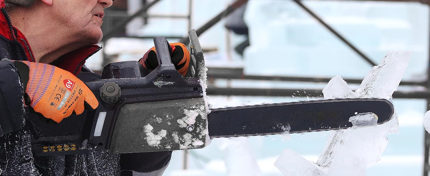Person using a chainsaw to cut ice with a blurred background