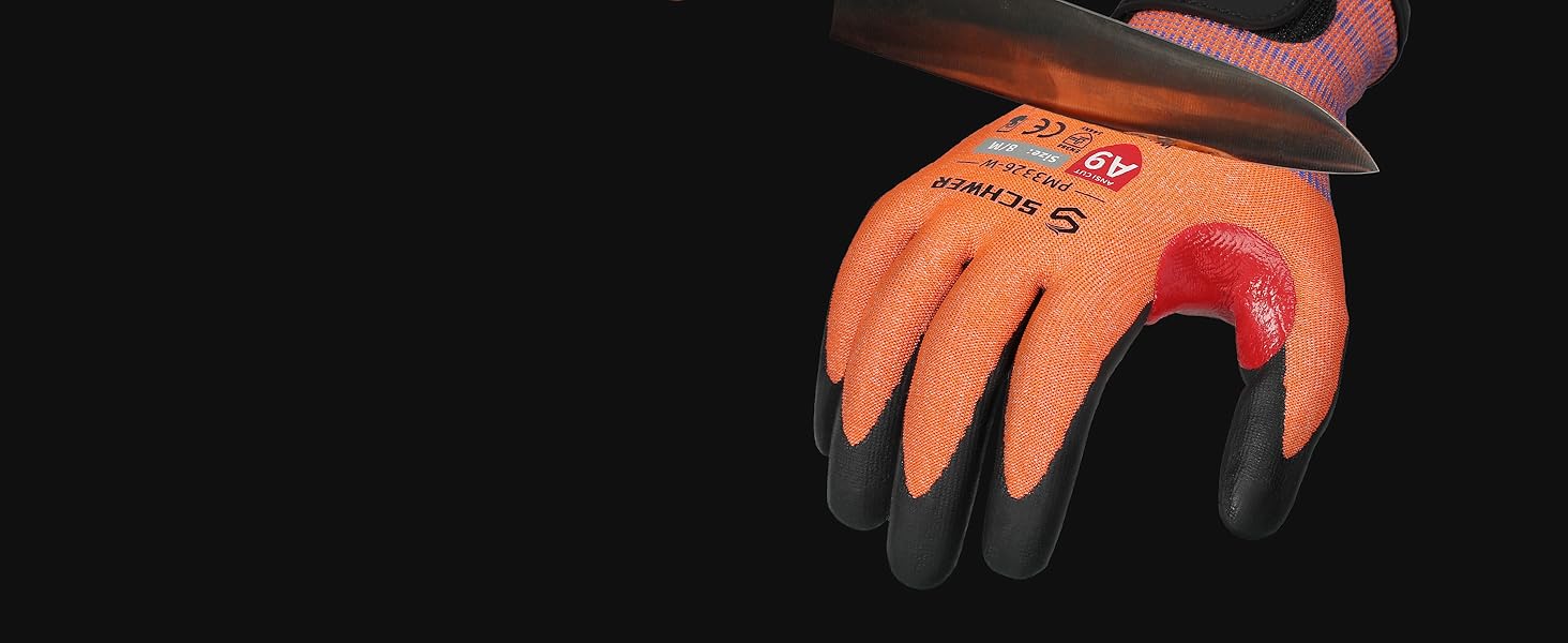 Orange gardening glove with black accents on a black background