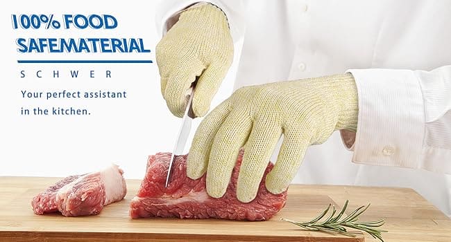Person cutting meat with gloves on a wooden board, promoting food-safe material.