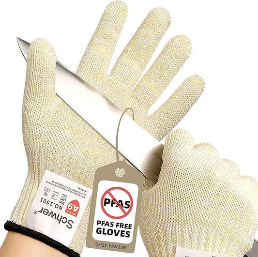 Cut-resistant kitchen gloves holding a sharp knife with PFAS free tag on white background