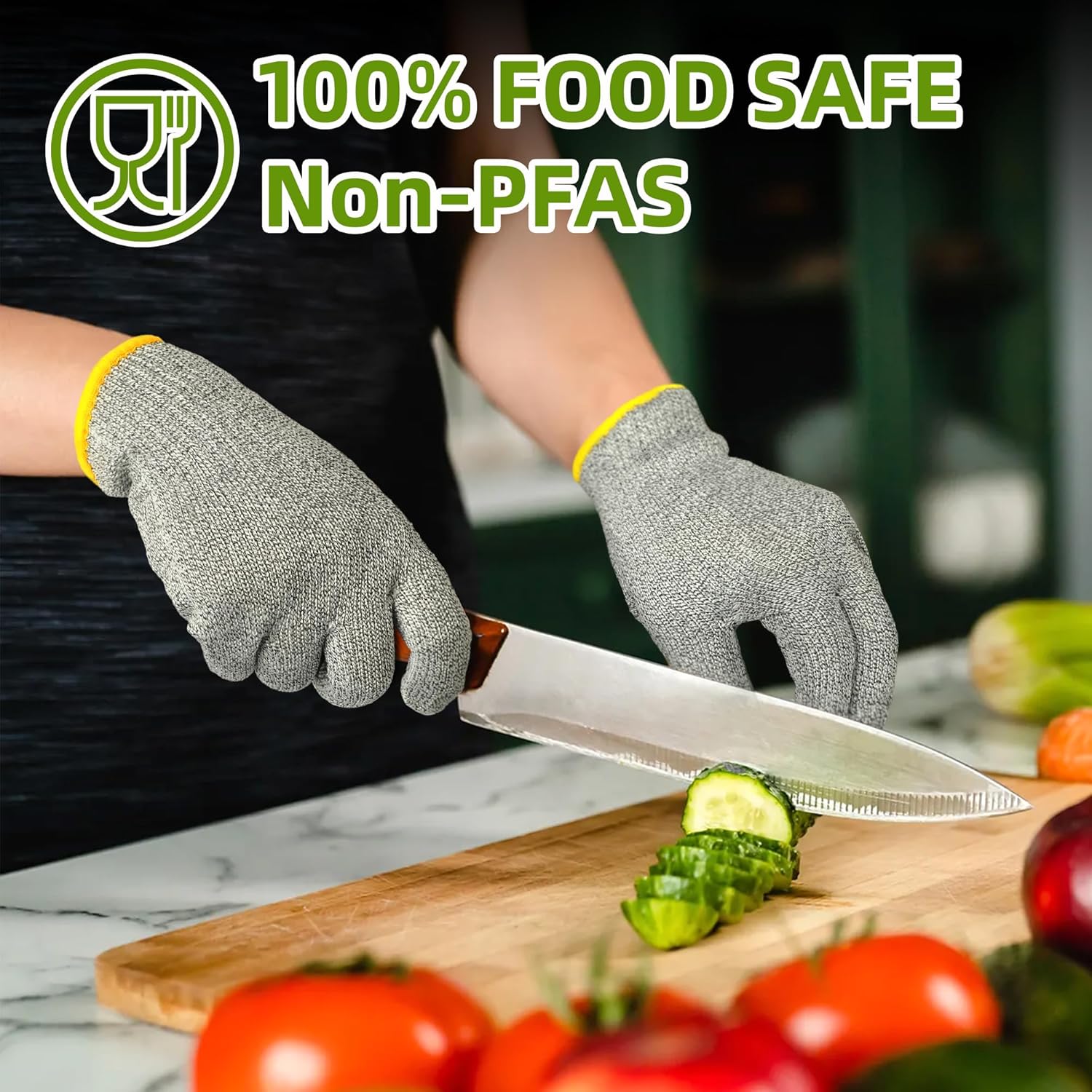 Person wearing gray cut-resistant gloves slicing cucumber on wooden cutting board with fresh vegetables nearby
