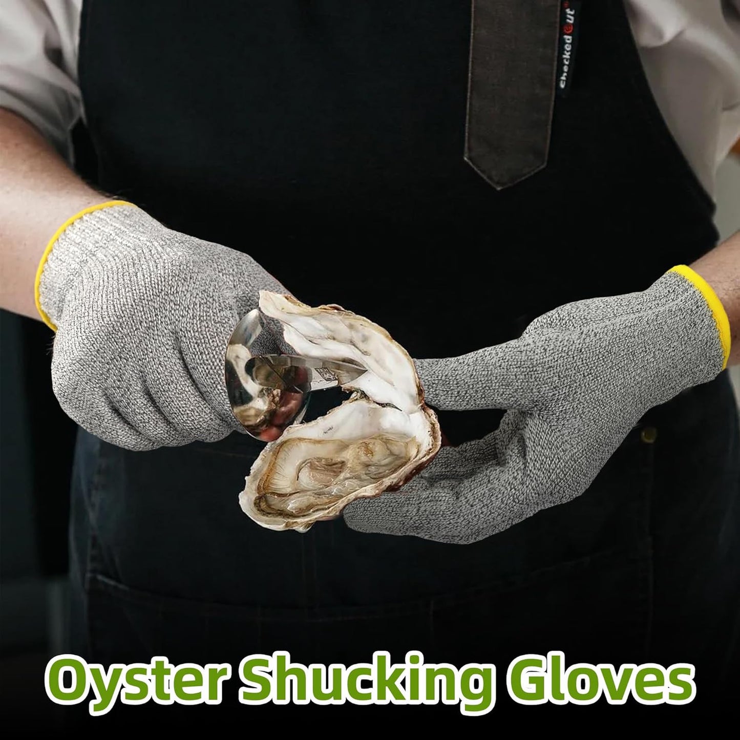 Person wearing gray cut-resistant oyster shucking gloves holding an opened oyster with a shucking knife