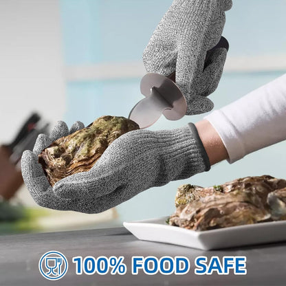 Person wearing cut-resistant gloves opening an oyster with a knife, on a blurred outdoor background.