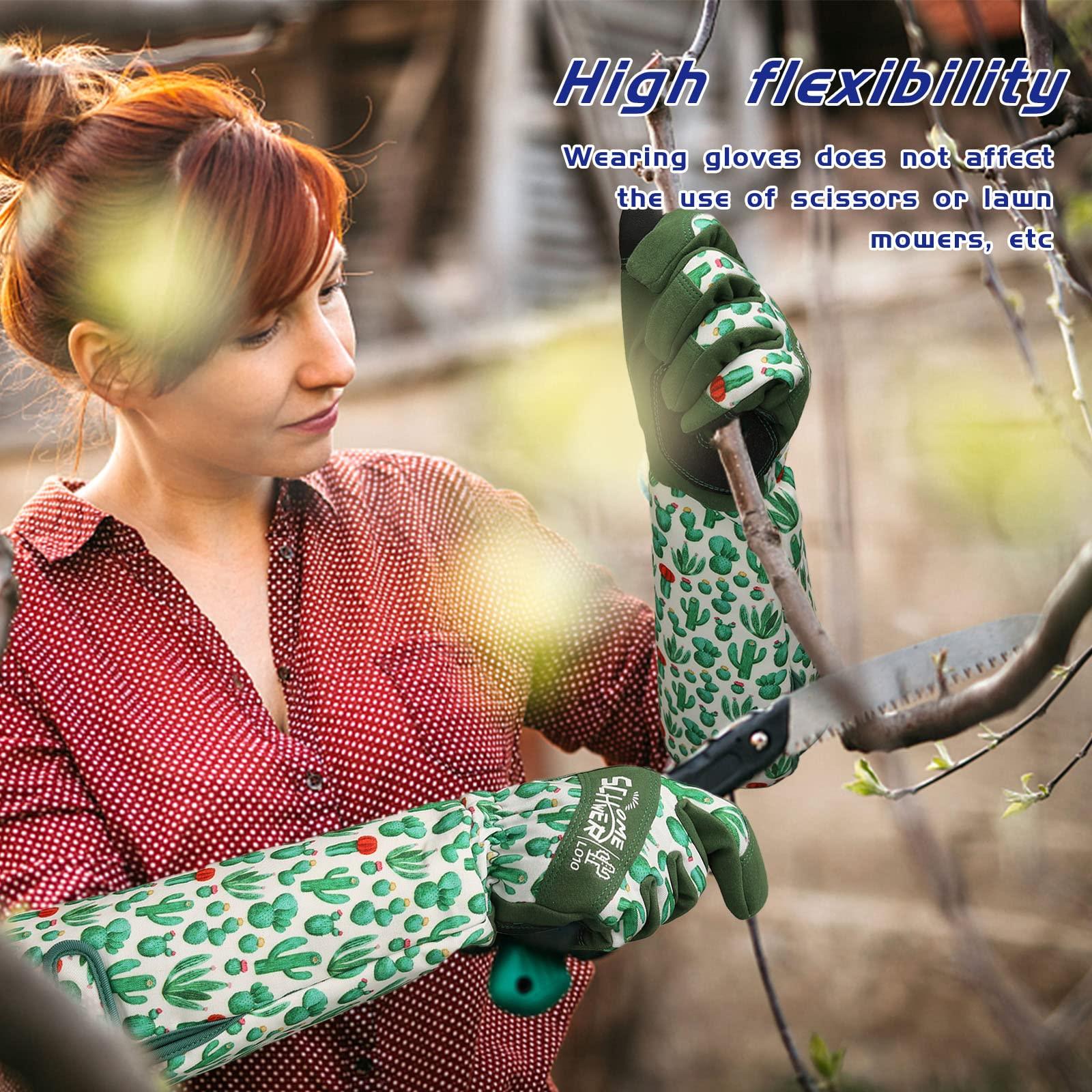 Woman wearing Schwergloves protective arm sleeves with green cactus print, pruning tree branches with a saw outdoors