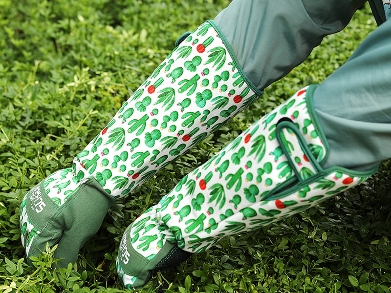 Gloves with a cactus pattern on grass
