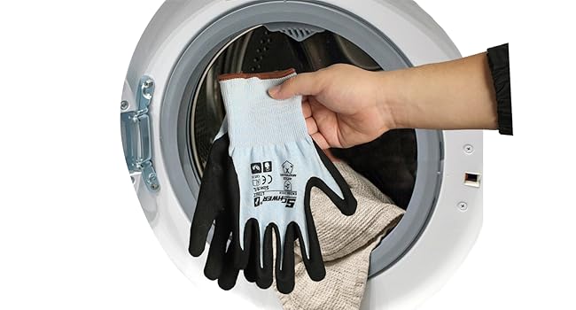 Person wearing gloves holding a shoe above a washing machine.
