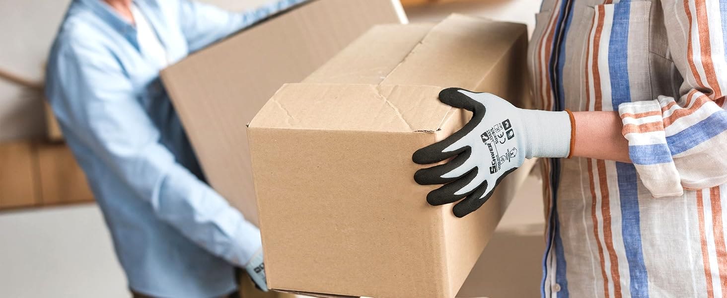 Person wearing gloves holding a cardboard box with another person in the background.