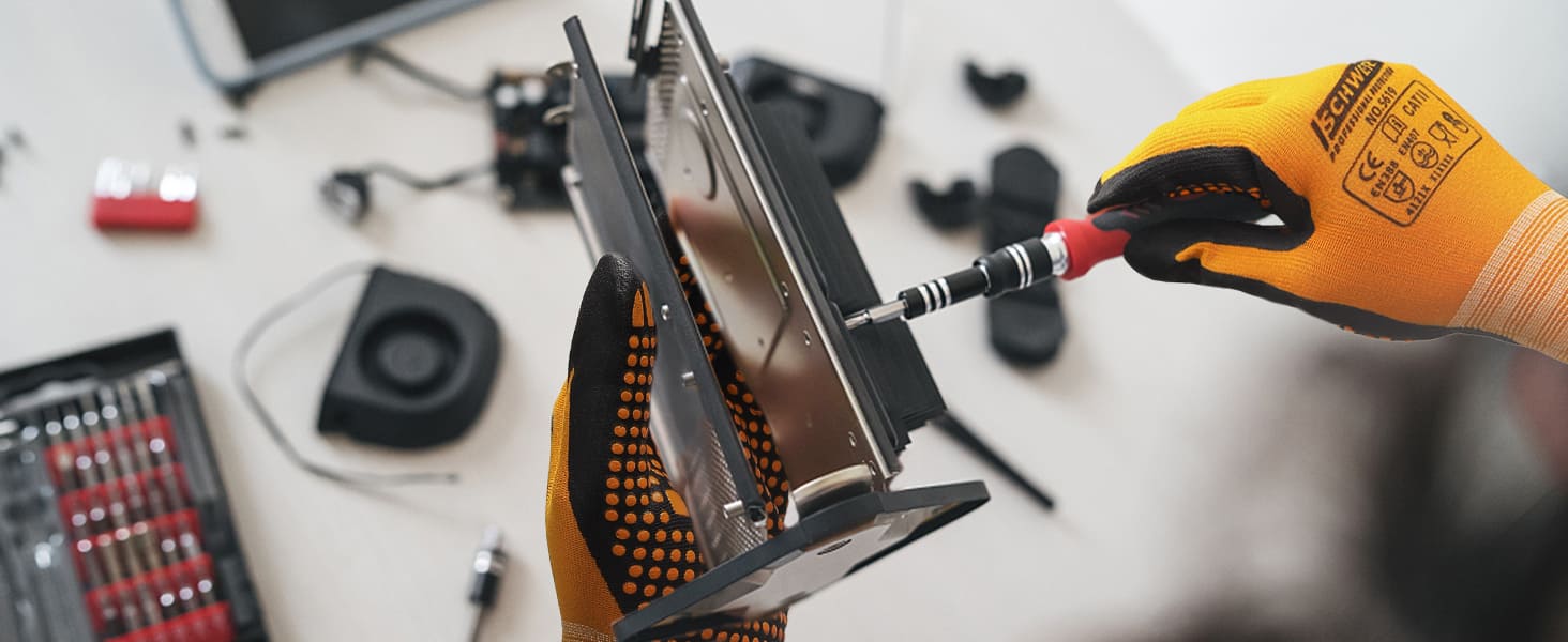 Person working on a computer hard drive with tools on a desk