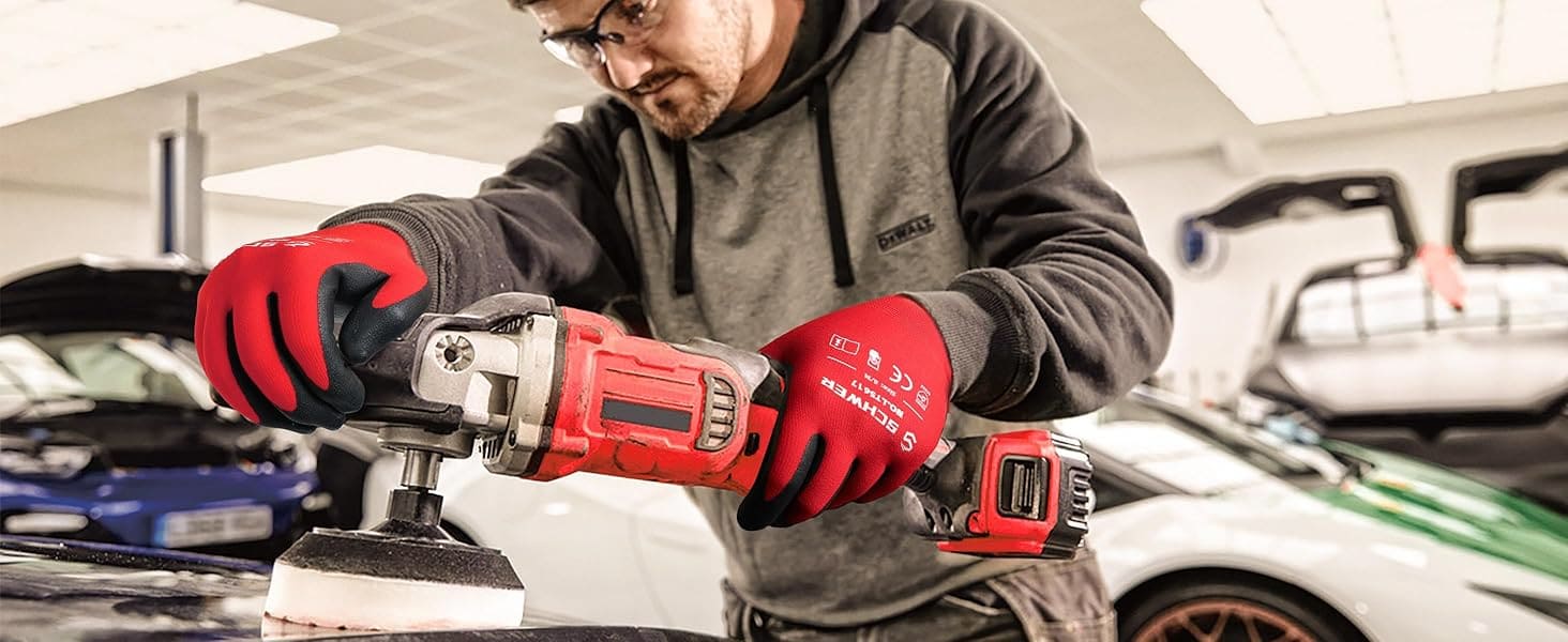 Person using a power tool in a garage setting with cars in the background