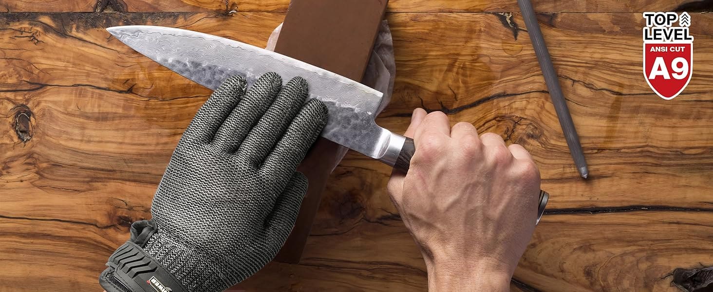 Person holding a chef's knife with a wooden background