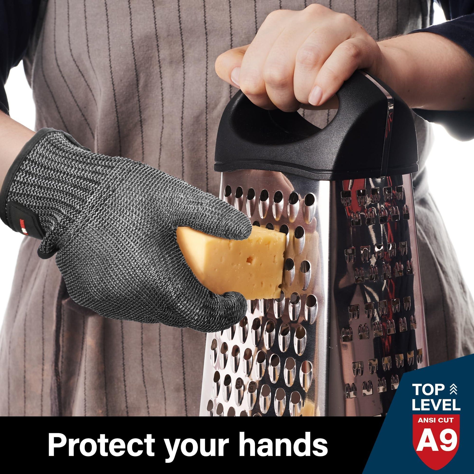 Person wearing cut-resistant glove grating cheese with metal box grater
