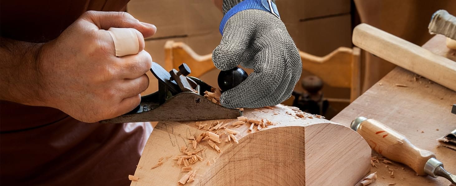 Person using a hand plane on a wooden surface with tools around