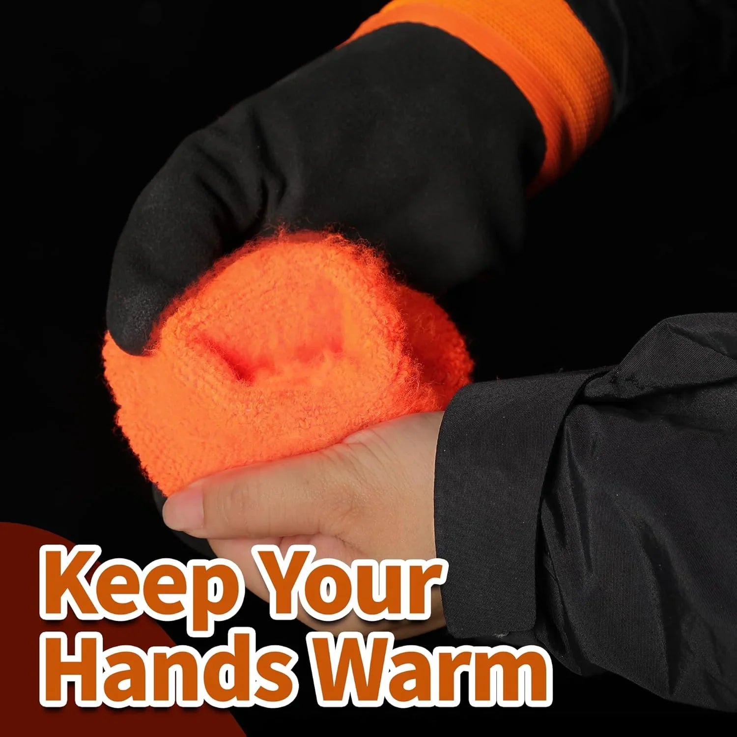 Hand wearing a black glove holding an orange foam hand warmer with text 'Keep Your Hands Warm' on a black background.