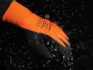 Orange protective glove with text on it being submerged in water.