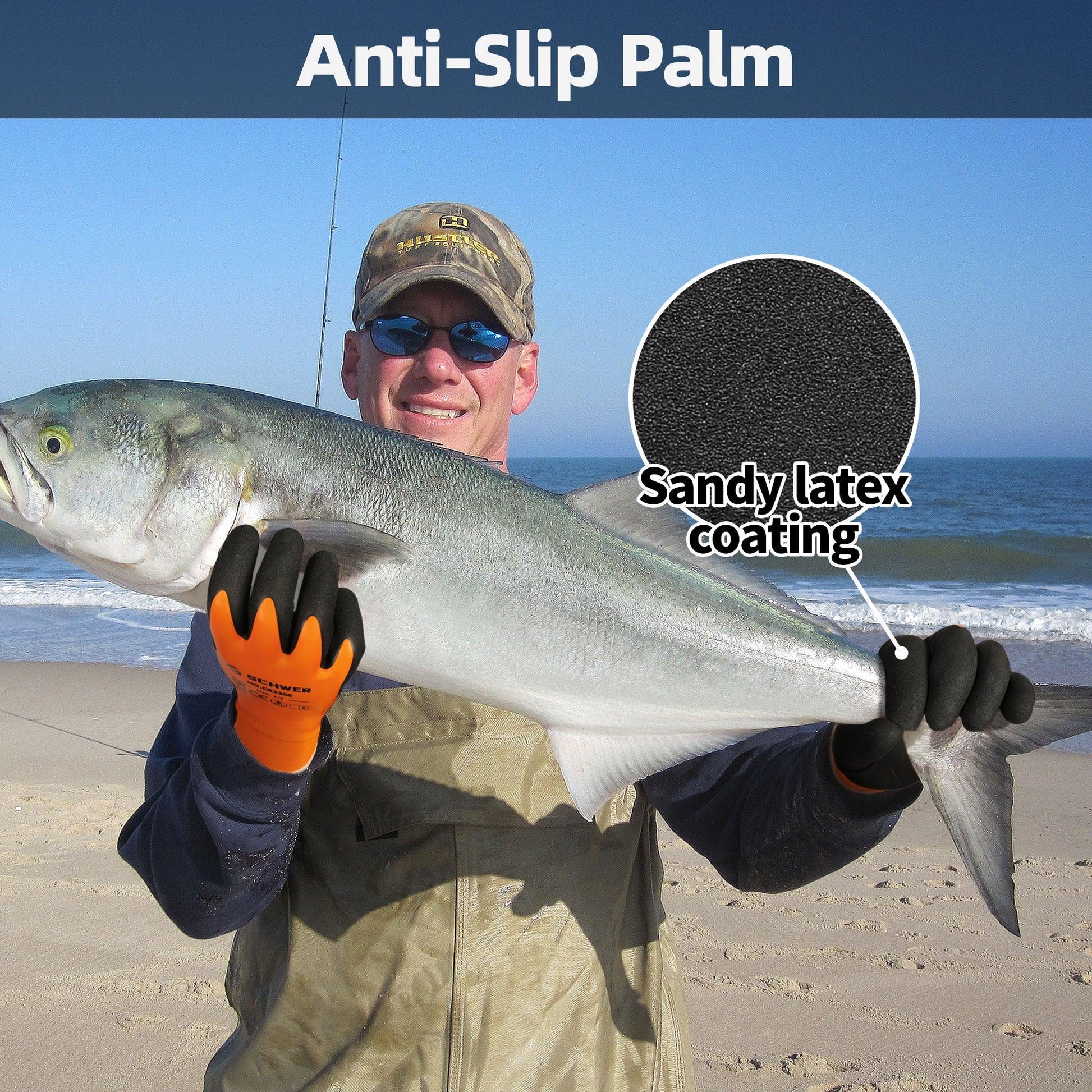 Man holding large fish on beach wearing orange and black anti-slip gloves with sandy latex coating